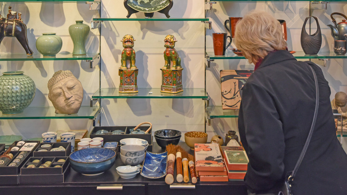 A customer browses the merchandise available at the Walters Art Museum Store.