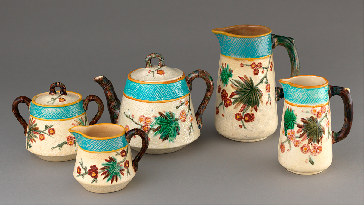 Arrangement of majolica tableware vessels with floral designs