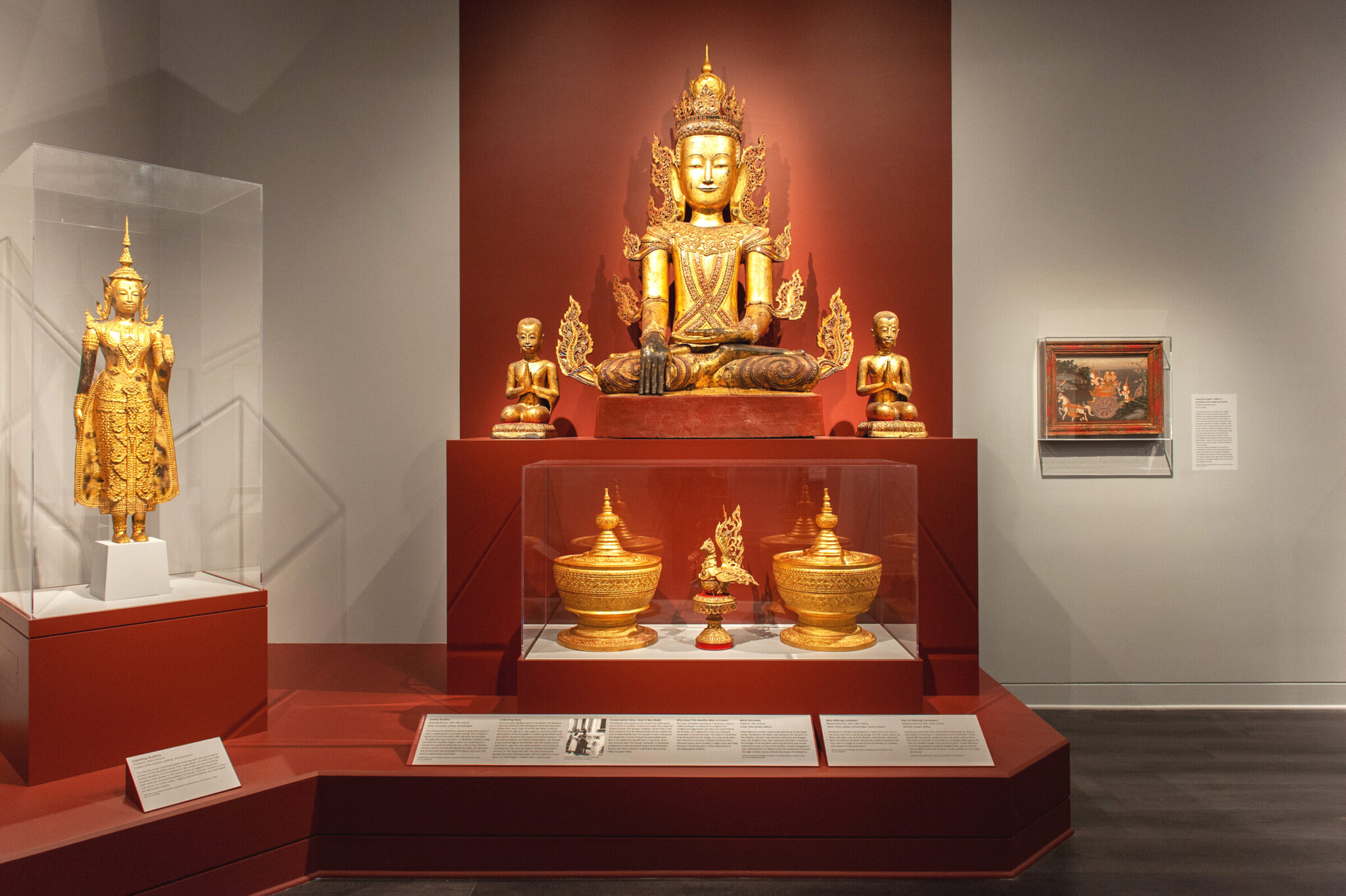 Gallery wall with Seated Buddha and other art objects