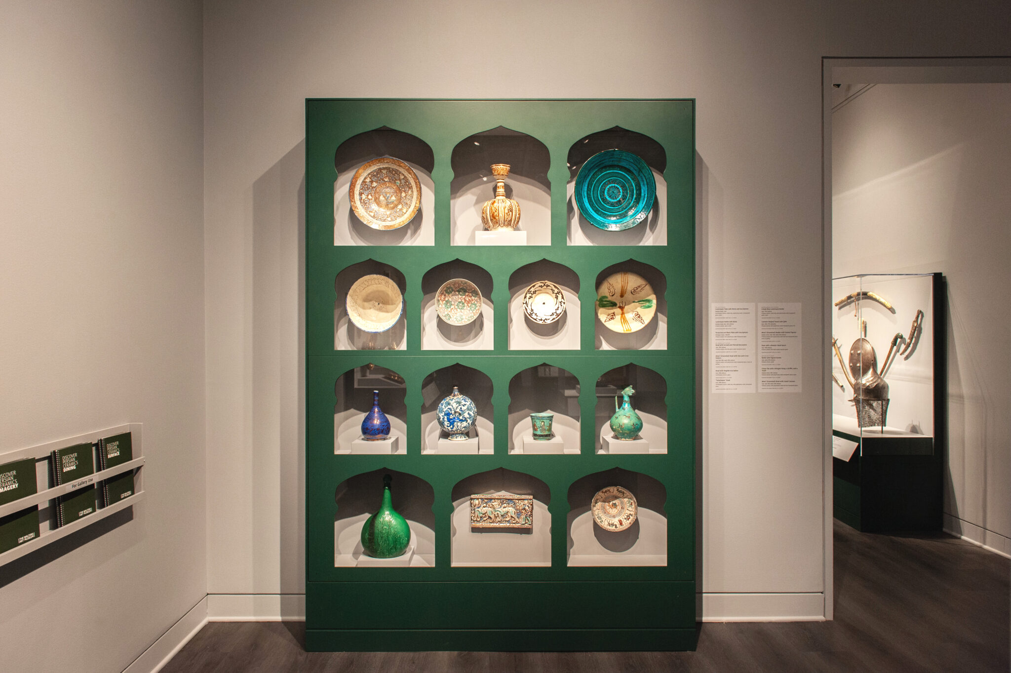 Wall with display of ceramic art objects