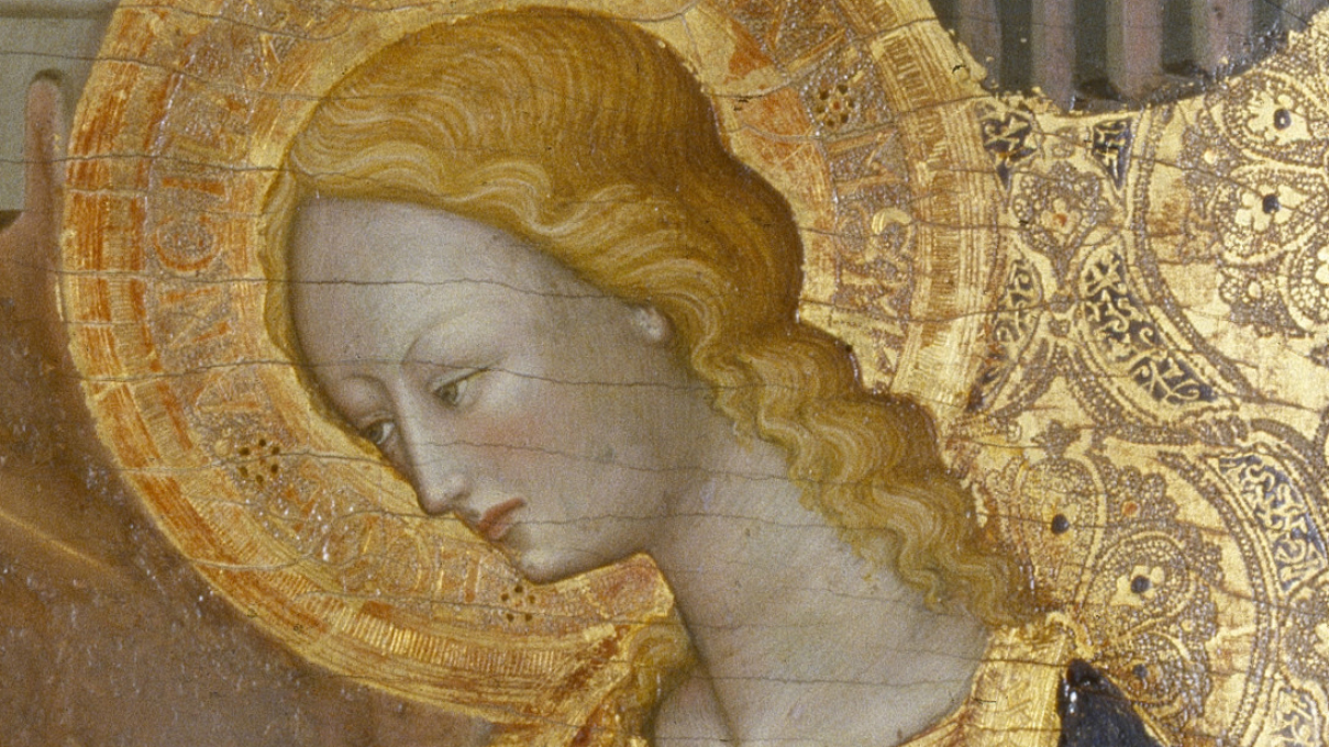 a woman's face with a golden halo