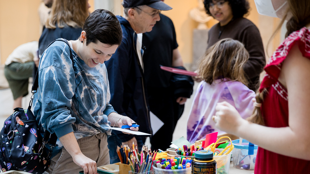 people of all ages making art together at the museum