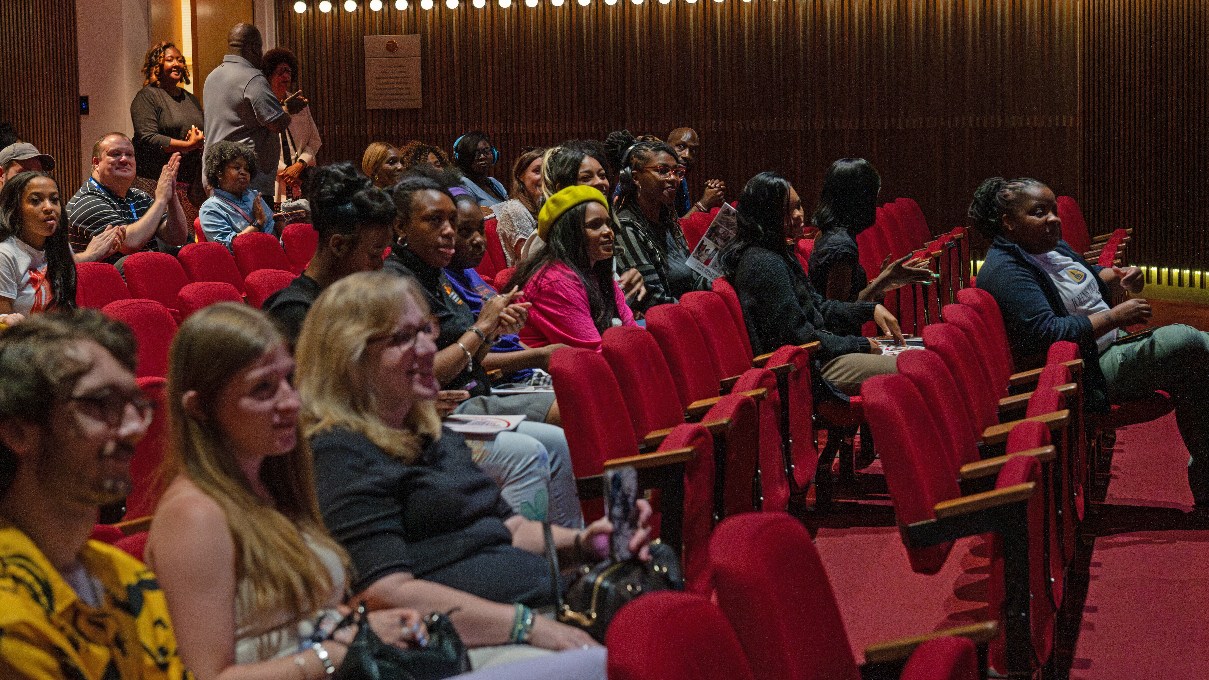 museum visitors in the auditorium for a film screening