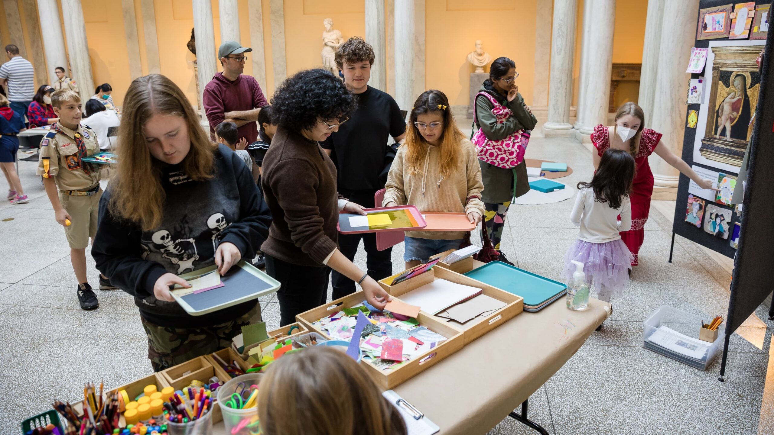 Museum visitors enjoy an art activity together