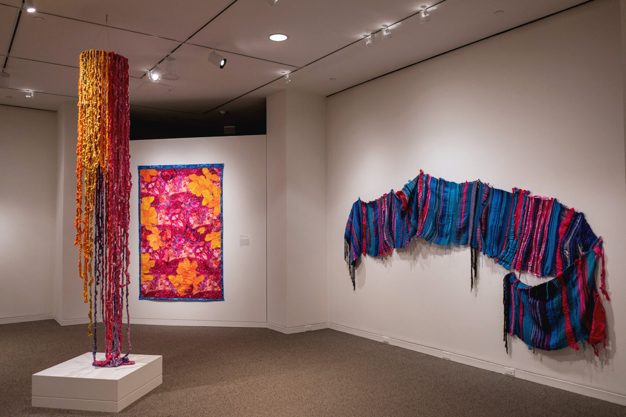 View of gallery multiple pieces of fiber artwork by Aliana Grace Bailey