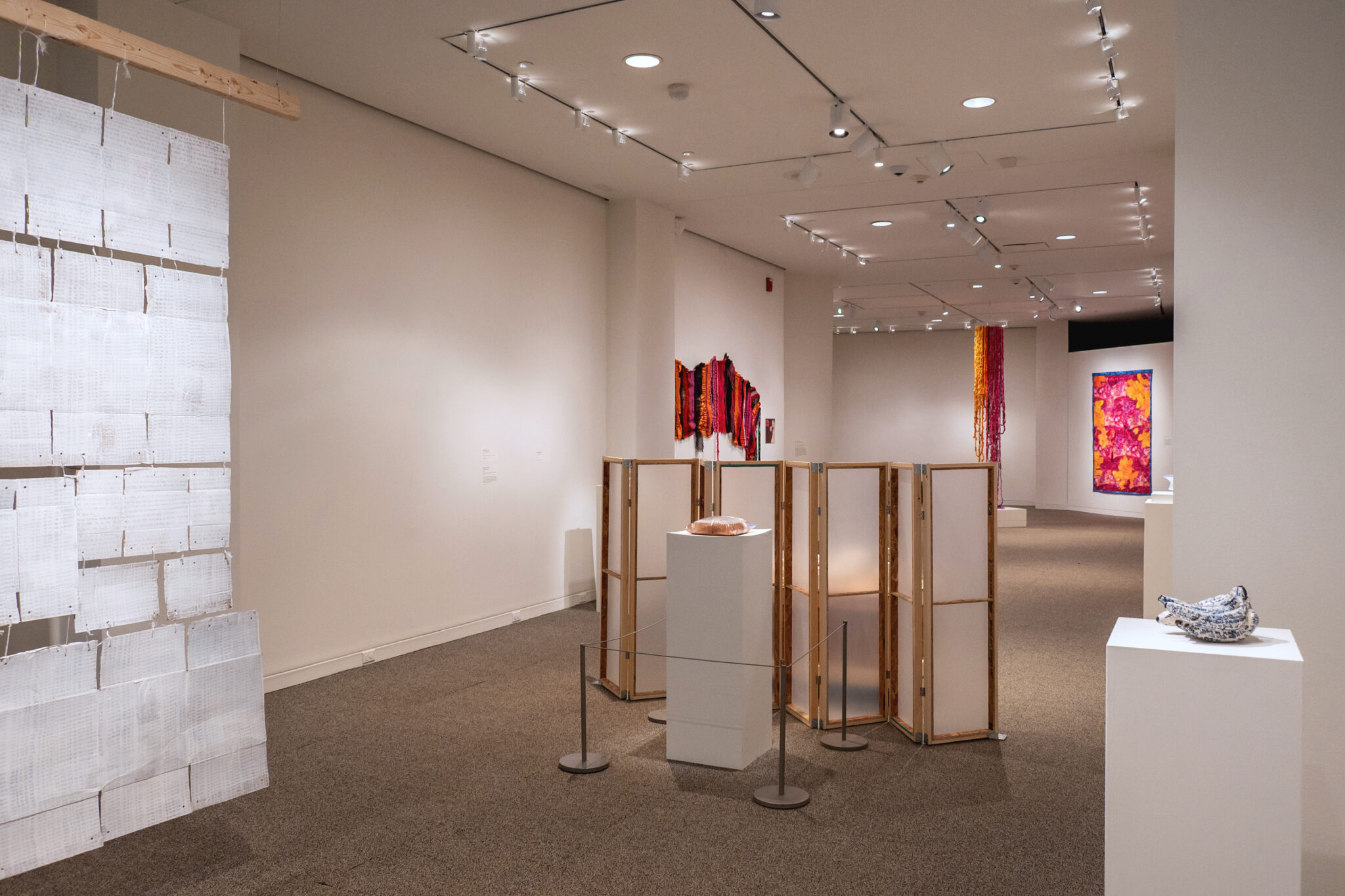 View of gallery with multiple pieces of artwork by Wonchul Ryu