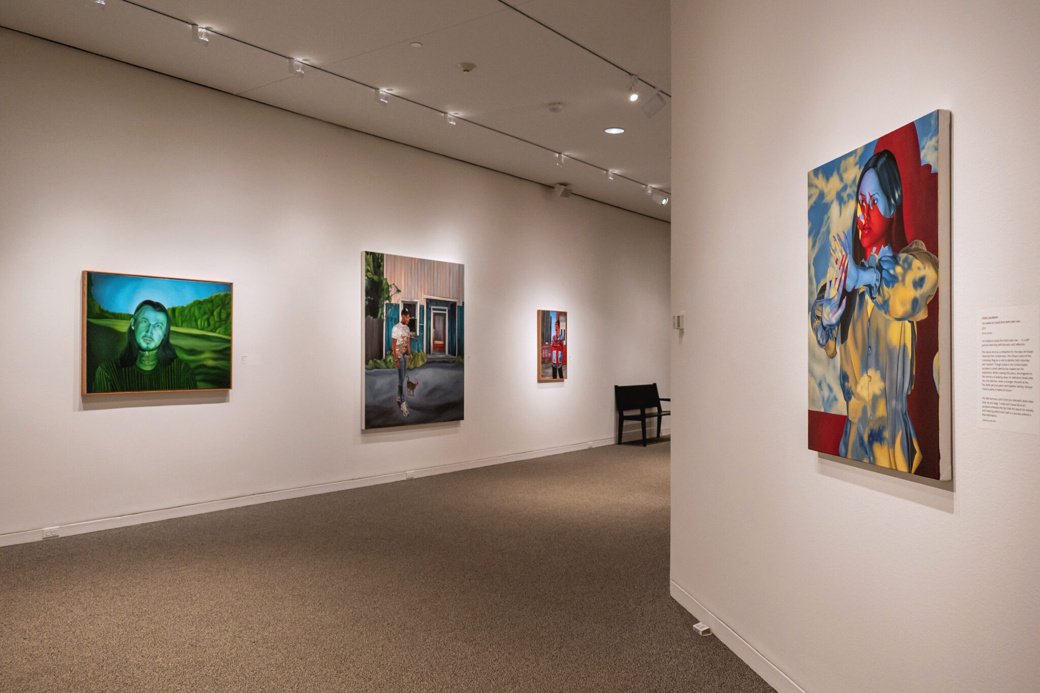 View of gallery with multiple paintings by Lillian Jacobson