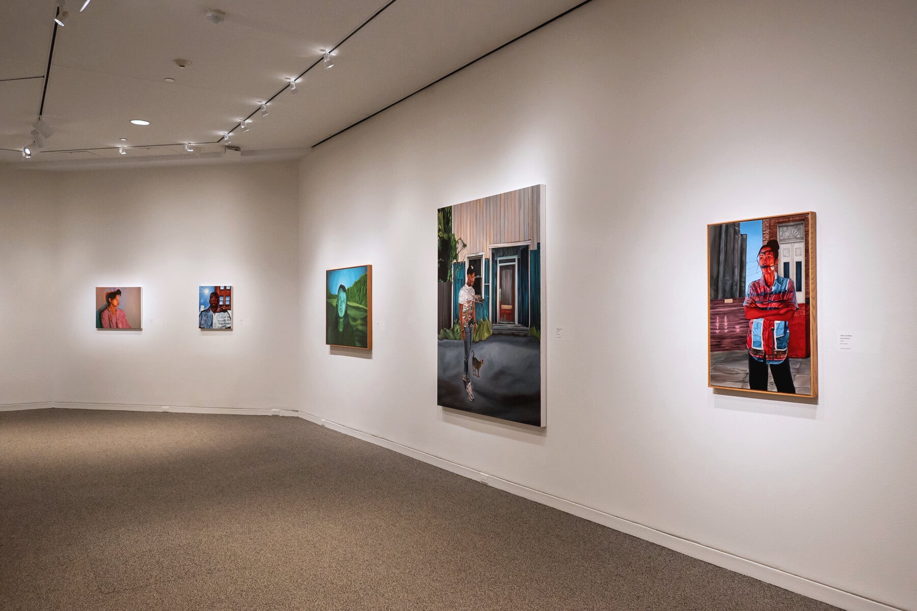 View of gallery with multiple paintings by Lillian Jacobson