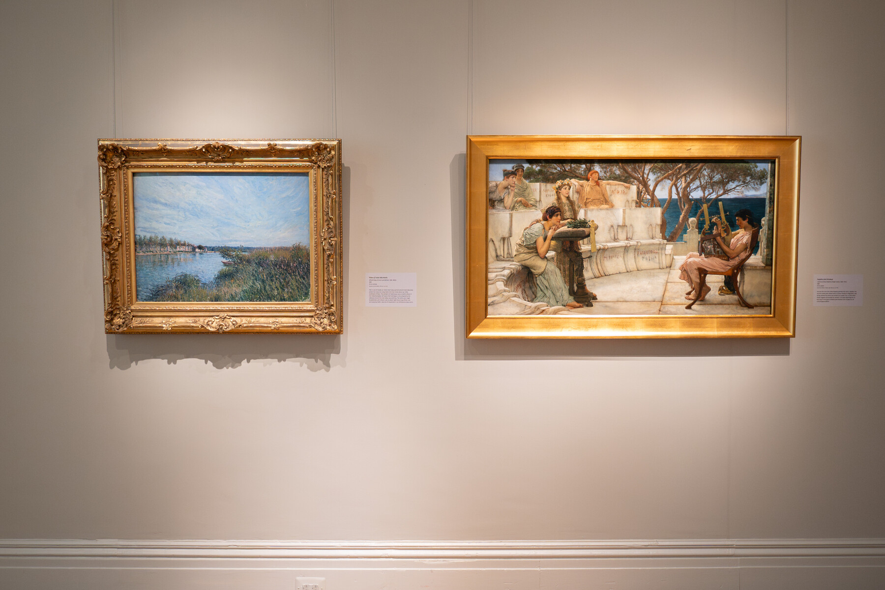 Two painting hung on a wall