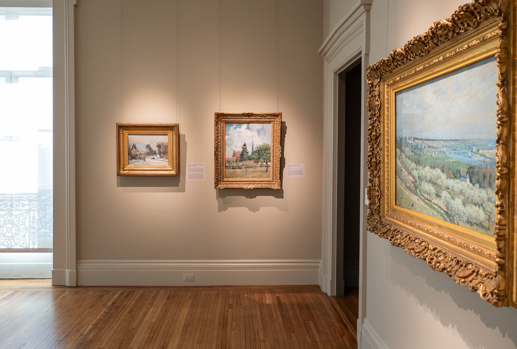 Several paintings in a gallery