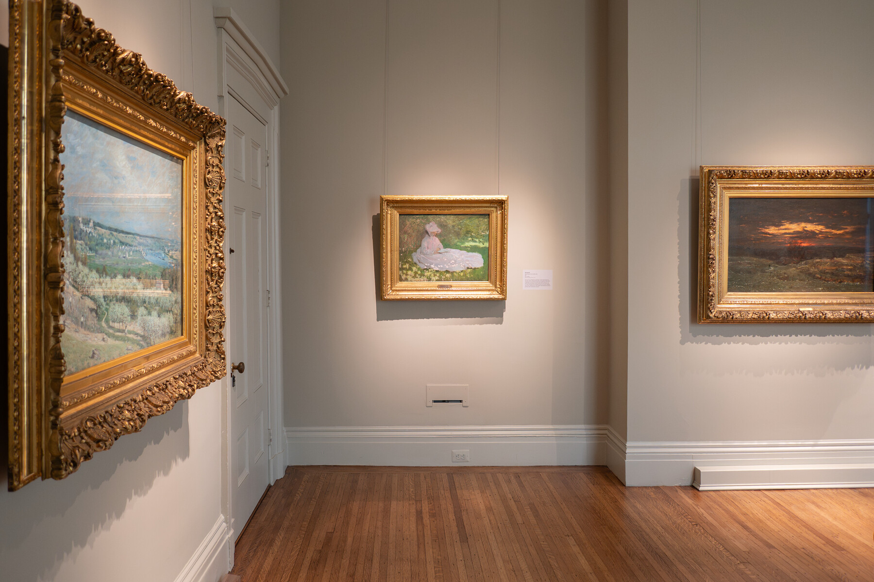 Several paintings in a gallery