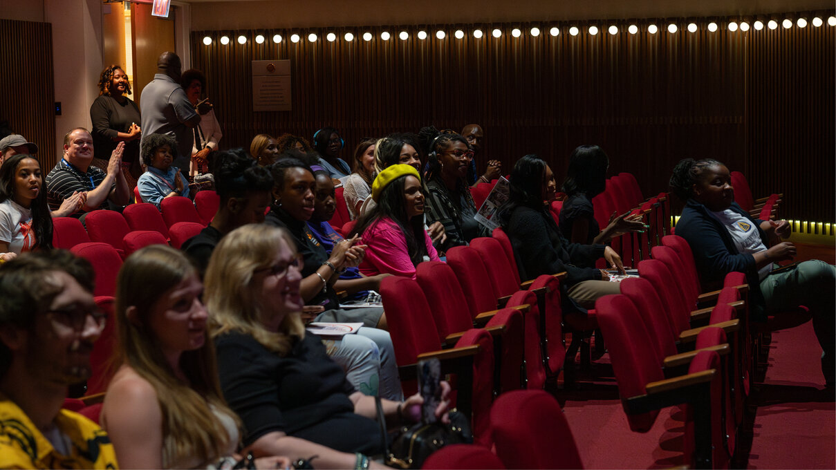 Moviegoers gathering in the museum's auditorium