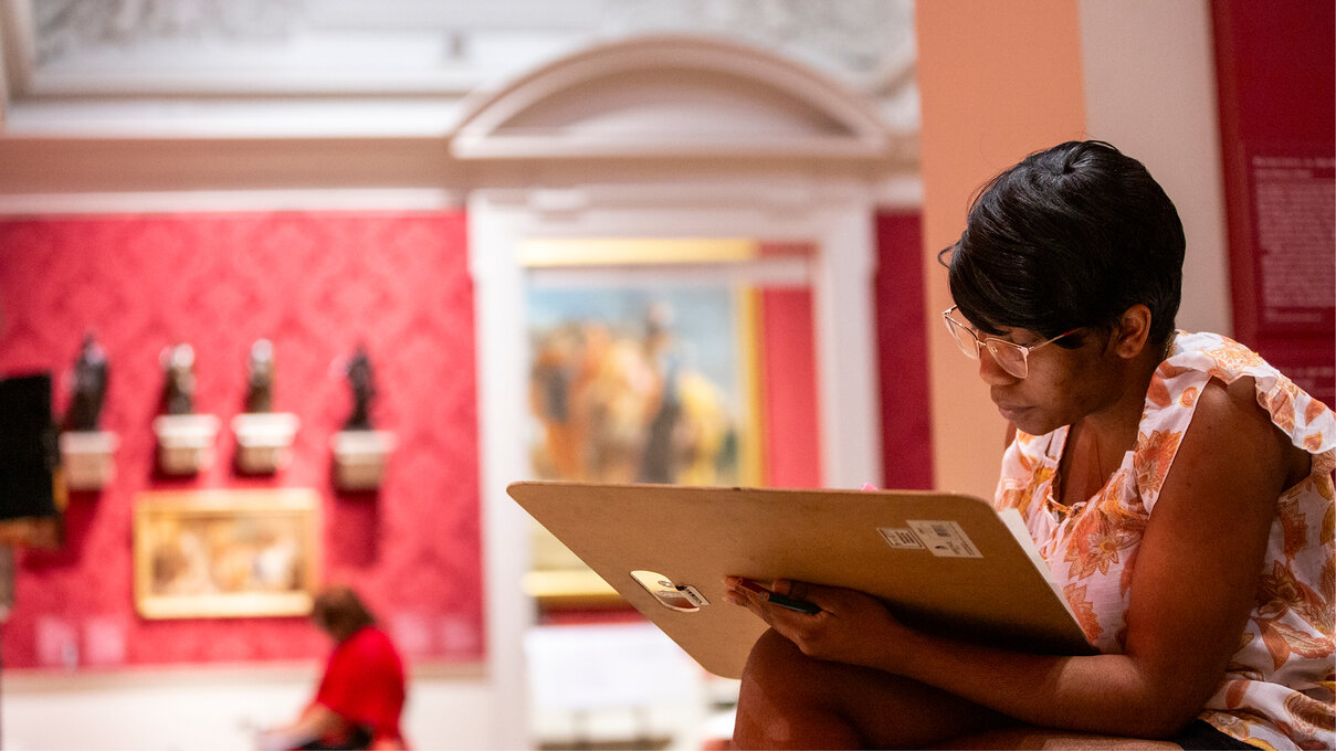 museum visitor sketching
