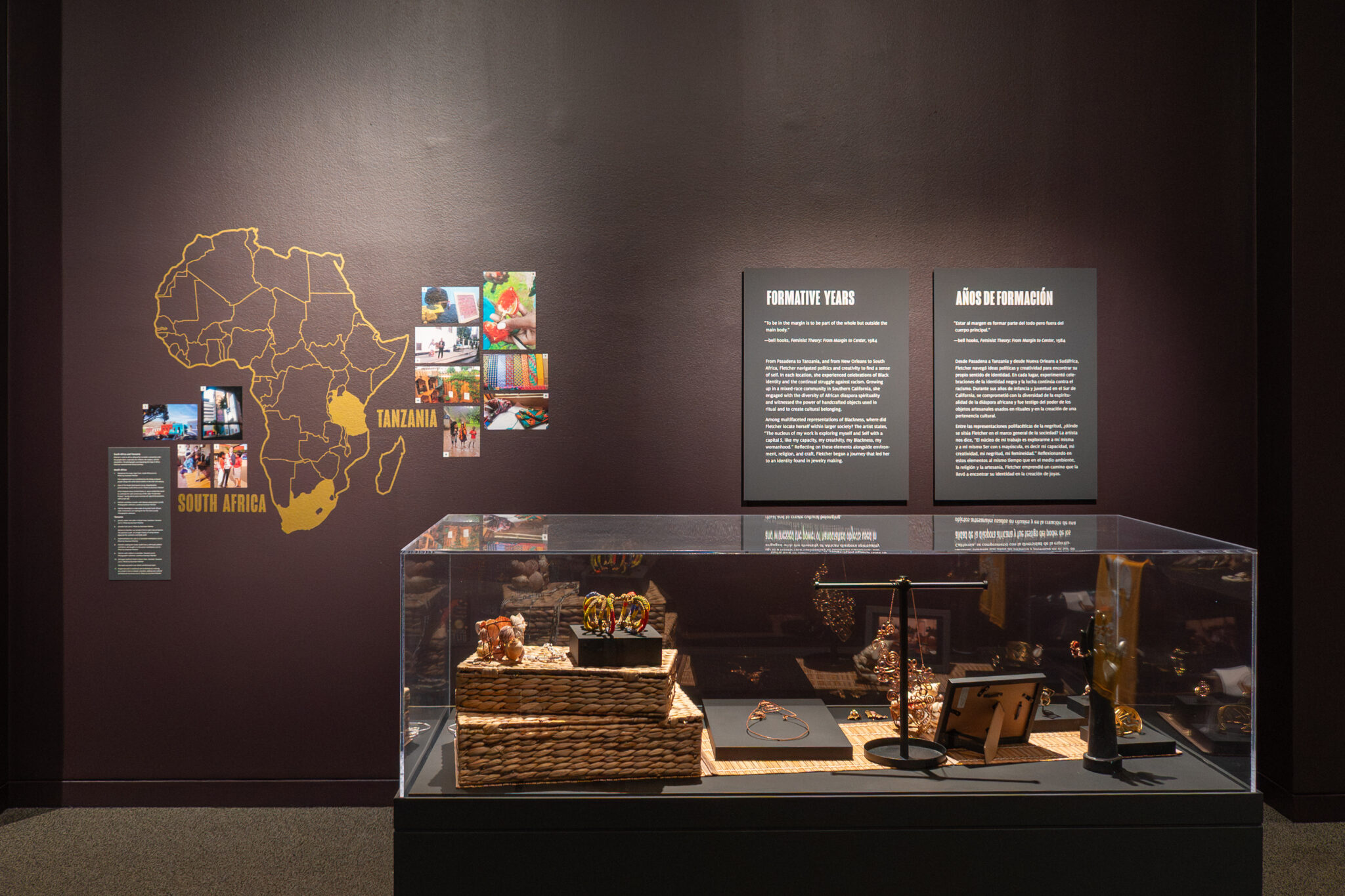 installation view of artwork, jewelry, and graphic map of africa