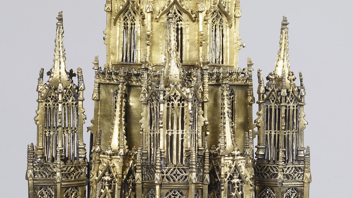 detail of golden reliquary in the shape of gothic spires