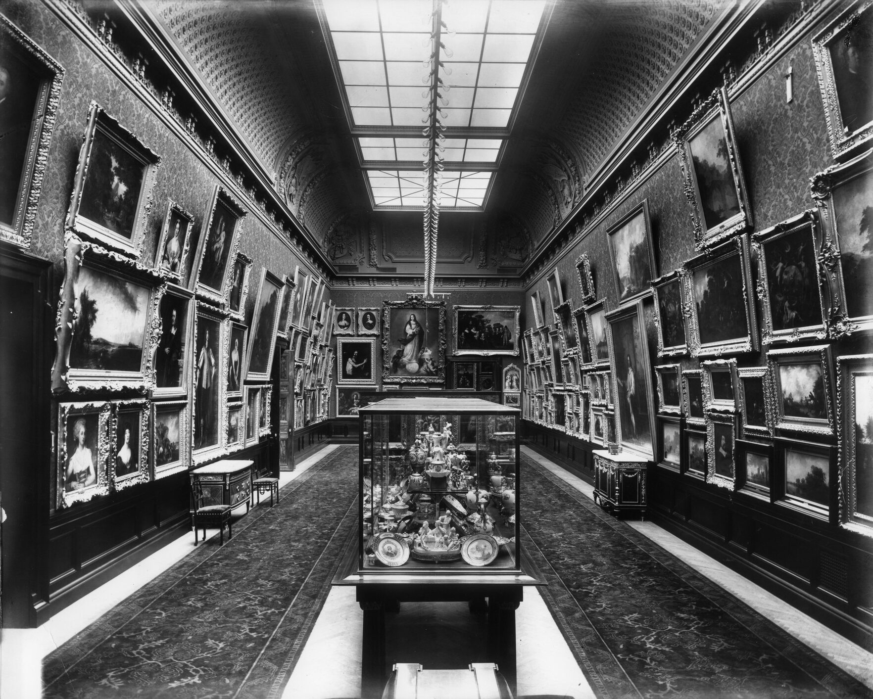 The Walters family art collection lines a gallery in the Palazzo building, circa 1909.