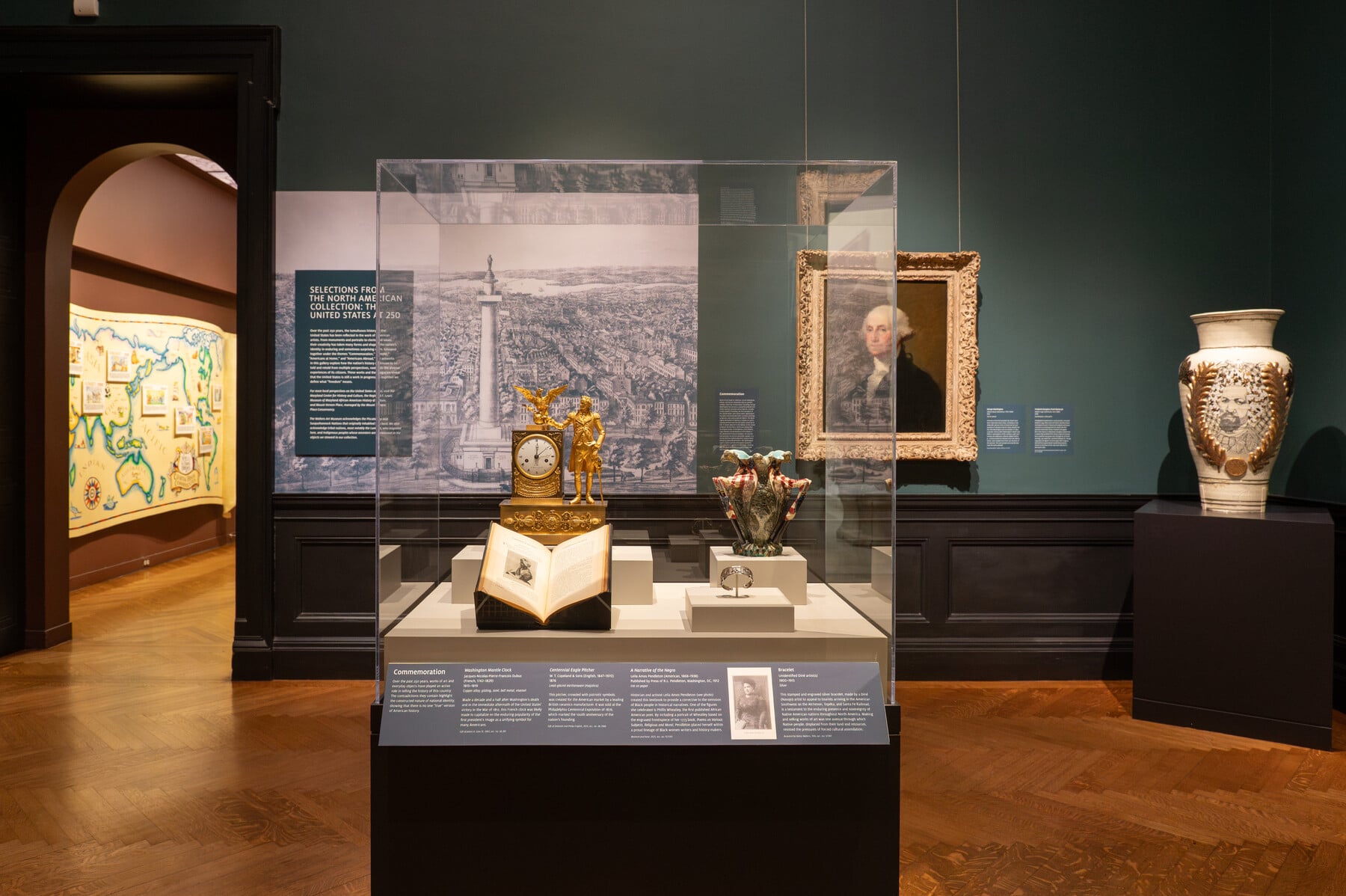 Gallery view of the United States at 250 with a case holding several art objects
