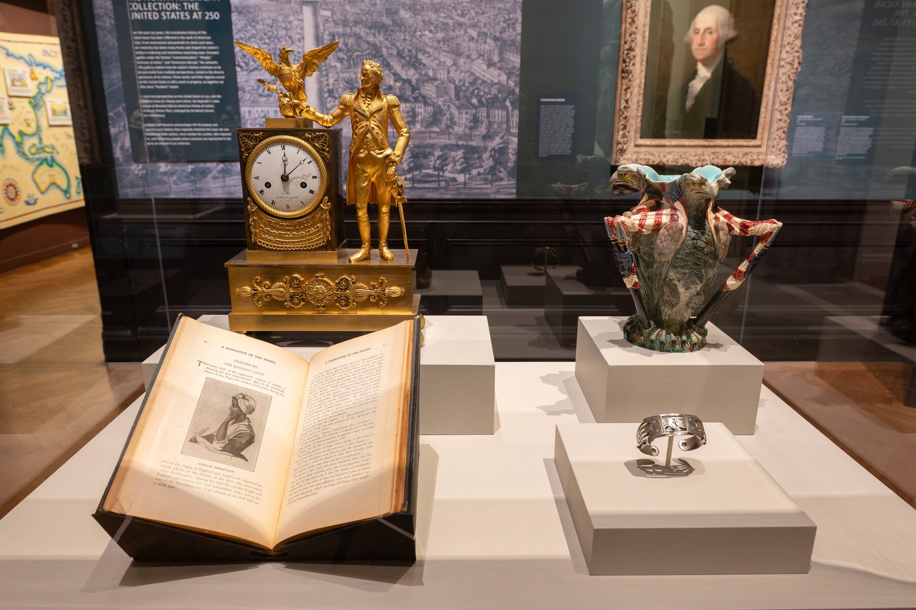 The interior of a case holding several art objects
